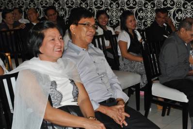 The happy faces of  groom's parents during the ceremony